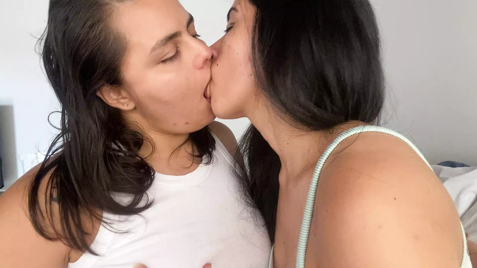 Lesbian girls kissing deeply with a lot of tongue